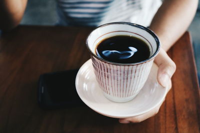 High angle view of coffee cup on table