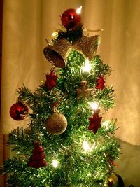 Low angle view of illuminated christmas tree