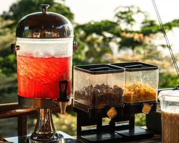 Alfresco breakfast buffet table during sunrise in a resort.