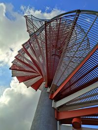 Low angle view of building against cloudy sky