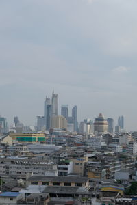 Buildings in city against sky