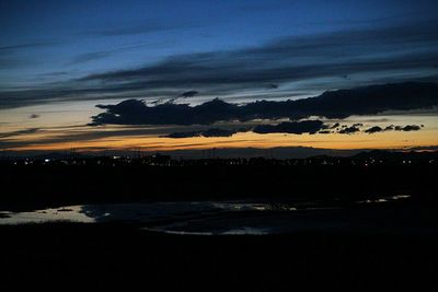 Scenic view of sea against sky at dusk