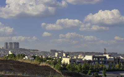 High angle view of buildings in city against sky