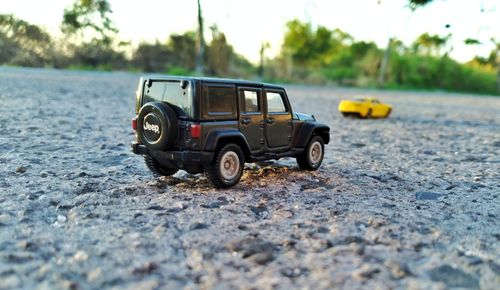 Close-up of toy car on road