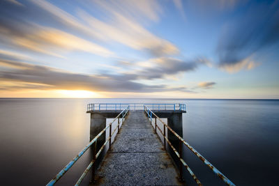 Jetty with railings leading into the sea, madeira.