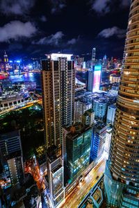 High angle view of illuminated buildings in city at night