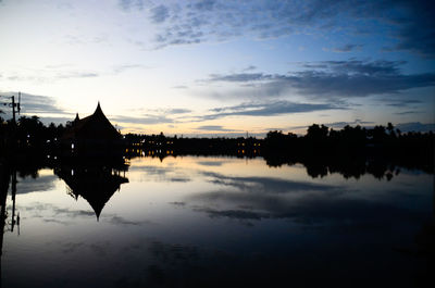 Silhouette of temple against sky during sunset