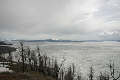 Scenic view of frozen lake against sky