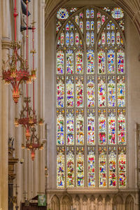 Lamps hanging against window in a church