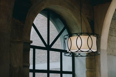 Illuminated pendant light hanging in restaurant