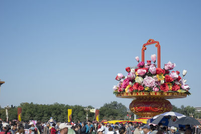 Group of people against clear sky