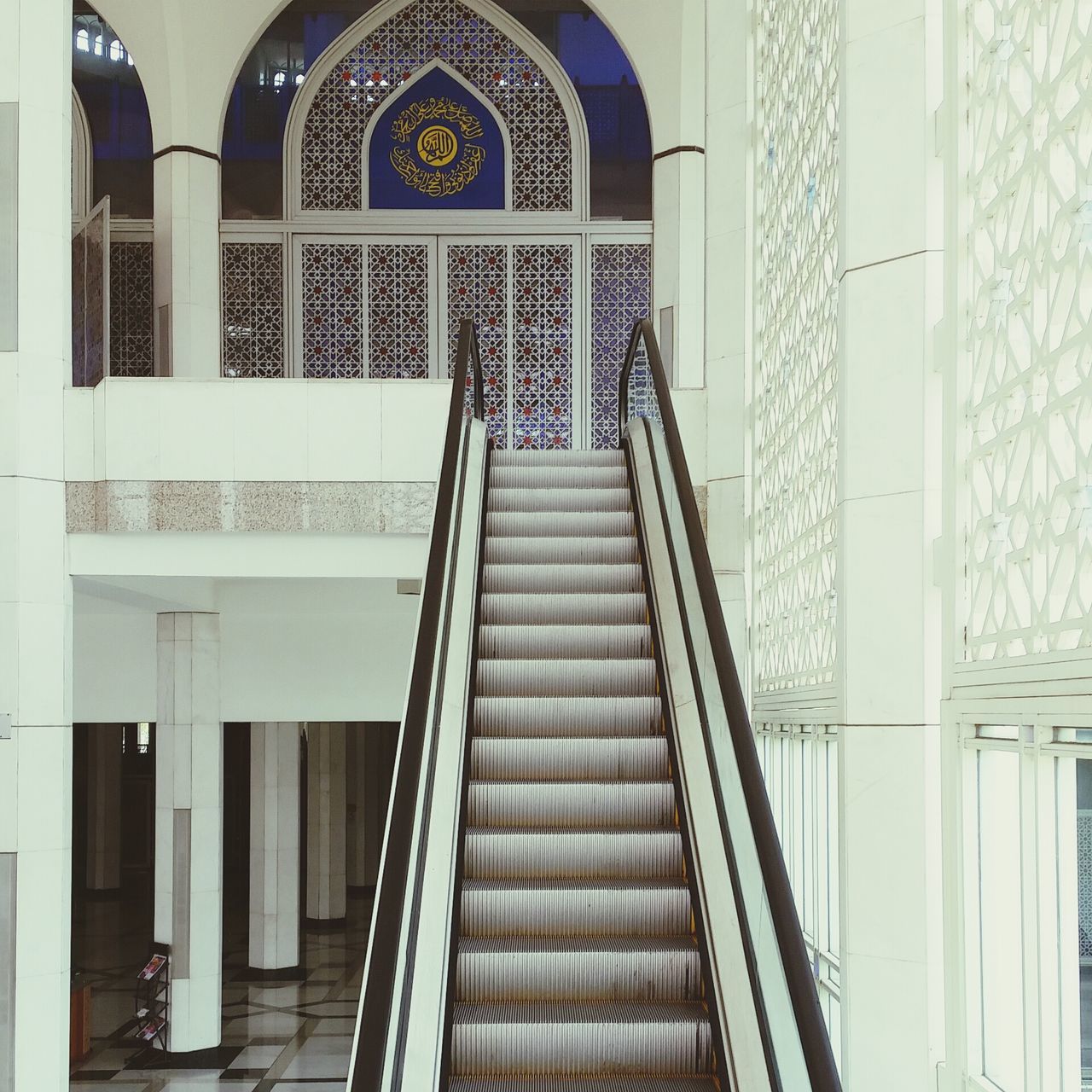 architecture, built structure, building exterior, arch, place of worship, window, indoors, low angle view, church, religion, railing, spirituality, building, entrance, architectural feature, architectural column, steps, day, famous place