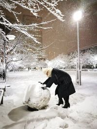 Man in snow against sky