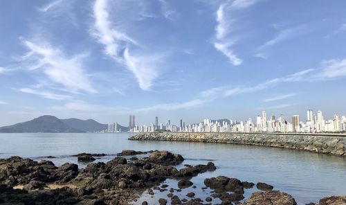 Scenic view of bay against sky