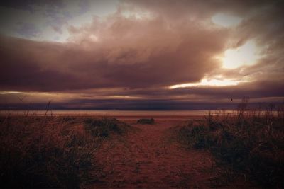 Scenic view of sea against cloudy sky