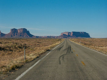 Empty country road along landscape