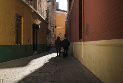 Rear view of people on road