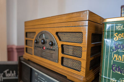 Antique old fashion style wooden radio speaker beside wall in house