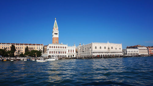 Church of san giorgio maggiore and doges palace by grand canal in city