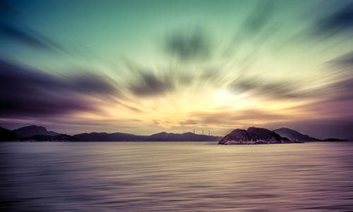 Scenic view of sea against sky at sunset