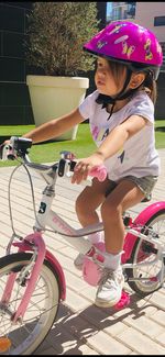 Full length of boy riding bicycle