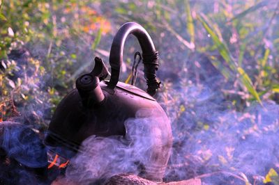 Close up of tea kettle on campfire