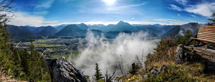 Panoramic view of land and mountains against sky