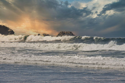 Scenic view of sea against sky during sunset