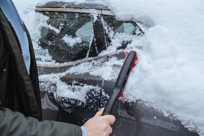 Low section of man washing car