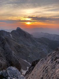 Scenic view of mountains against sky during sunset