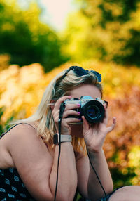 Midsection of woman photographing