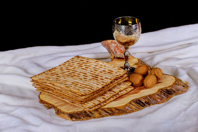 Close-up of drink on table against black background