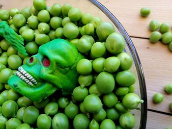 Close-up of green fruits on table