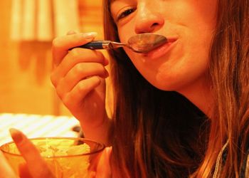 Close-up of woman eating ice cream