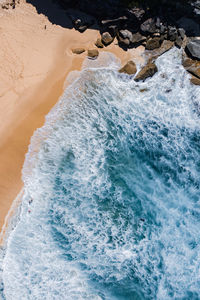 High angle view of surf on beach