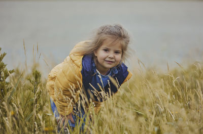 Young woman standing on field