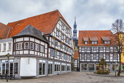 Exterior of buildings in town against sky