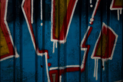 Full frame shot of multi colored graffiti on wall