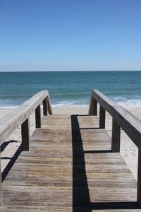 View of calm blue sea against clear sky