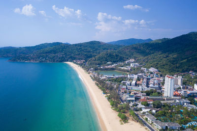 Panoramic view of sea and buildings against sky