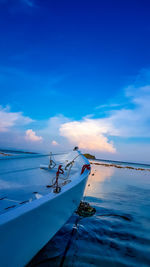 Scenic view of sea against blue sky