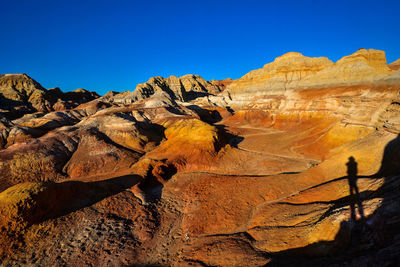 Scenic view of desert against clear sky