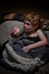 Young woman lying on sofa