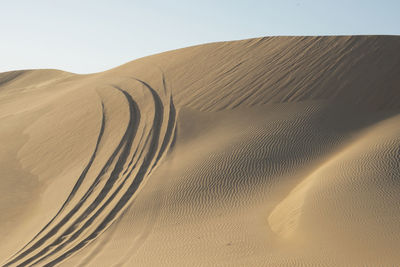 Scenic view of desert against clear sky