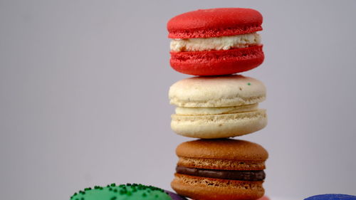 Close-up of macaroons against white background