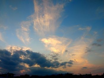 Low angle view of cloudy sky during sunset