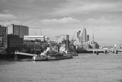 Panoramic view of london skyline and hms belfast against sky with river  thames in foreground
