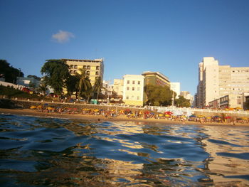 View of cityscape against blue sky