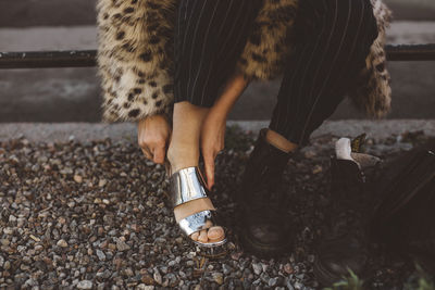 Woman putting shoes on