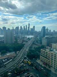 High angle view of cityscape against cloudy sky